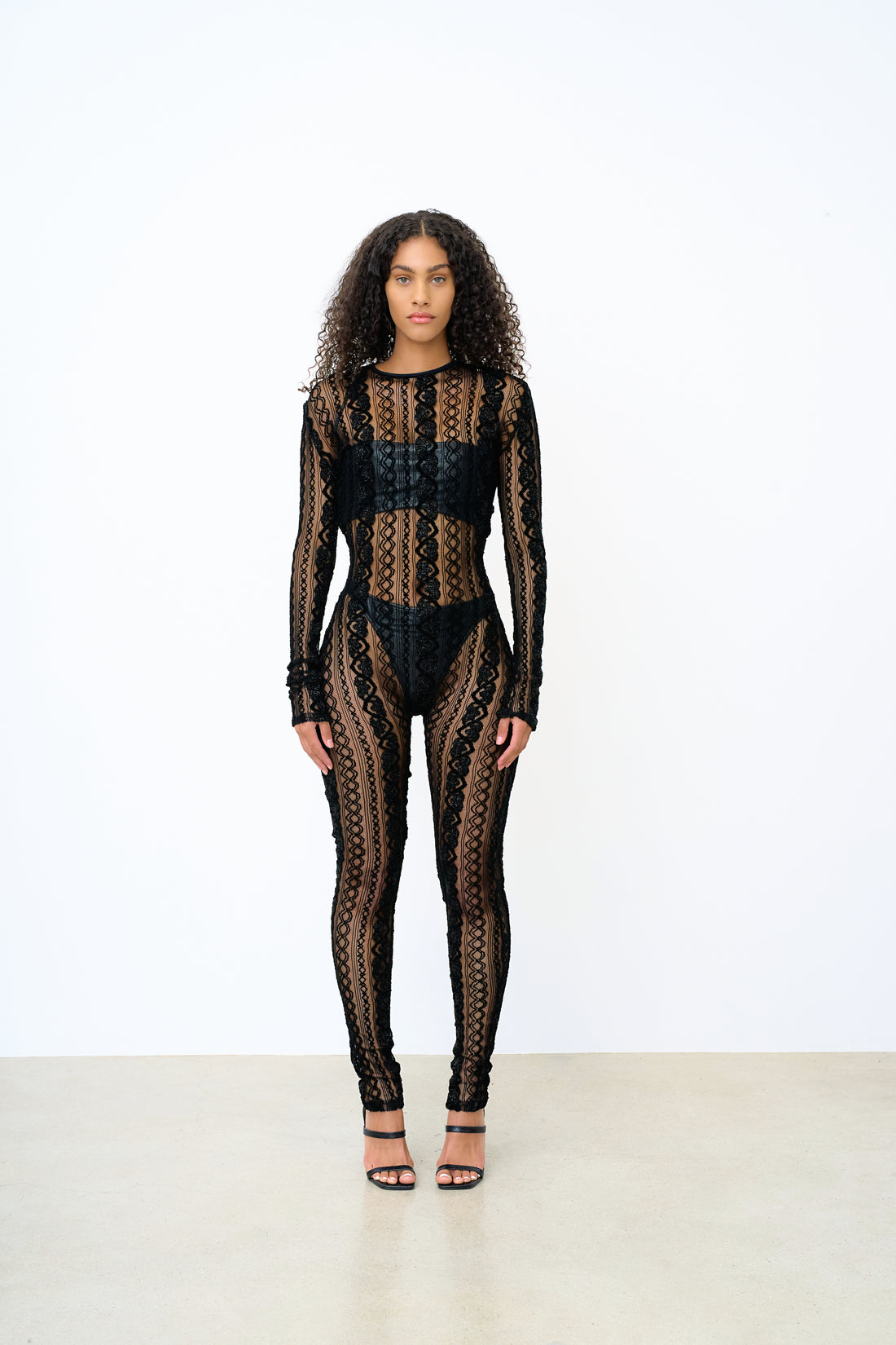 Lace bodysuit with intricate detailing for a delicate, feminine look