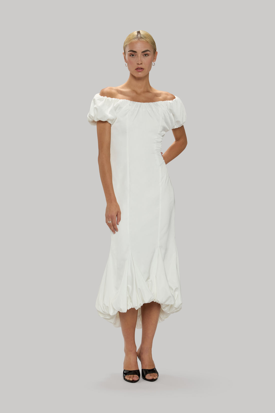 Balloon midi dress with on/off shoulder design and voluminous silhouette.