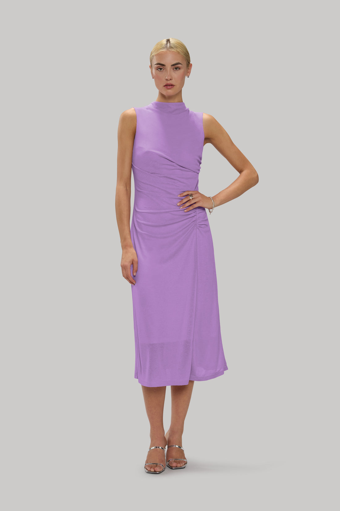 High-neck slinky dress with ruched detailing and a flattering fit.
