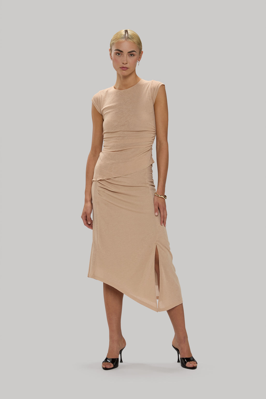 Slinky ruched cap-sleeve tee with a flattering fit and soft fabric.