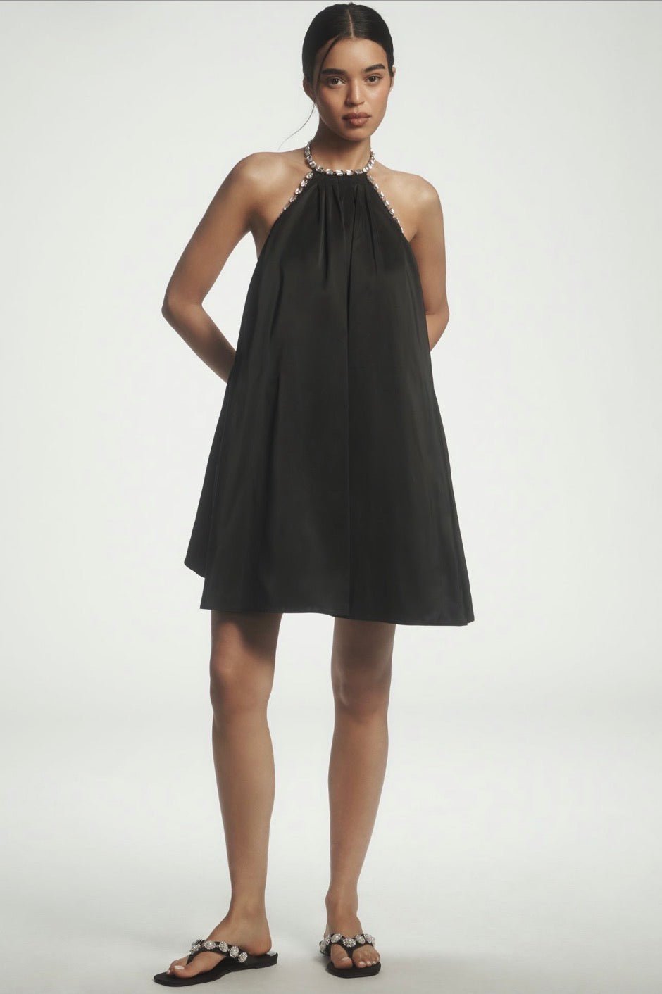 embellished halterneck mini dress Elix in Black The Oh Polly halterneck hot fix embellished mini dress in beige offers a stunning blend of elegance and modern style Pleated Halter Embellished Mini Dress